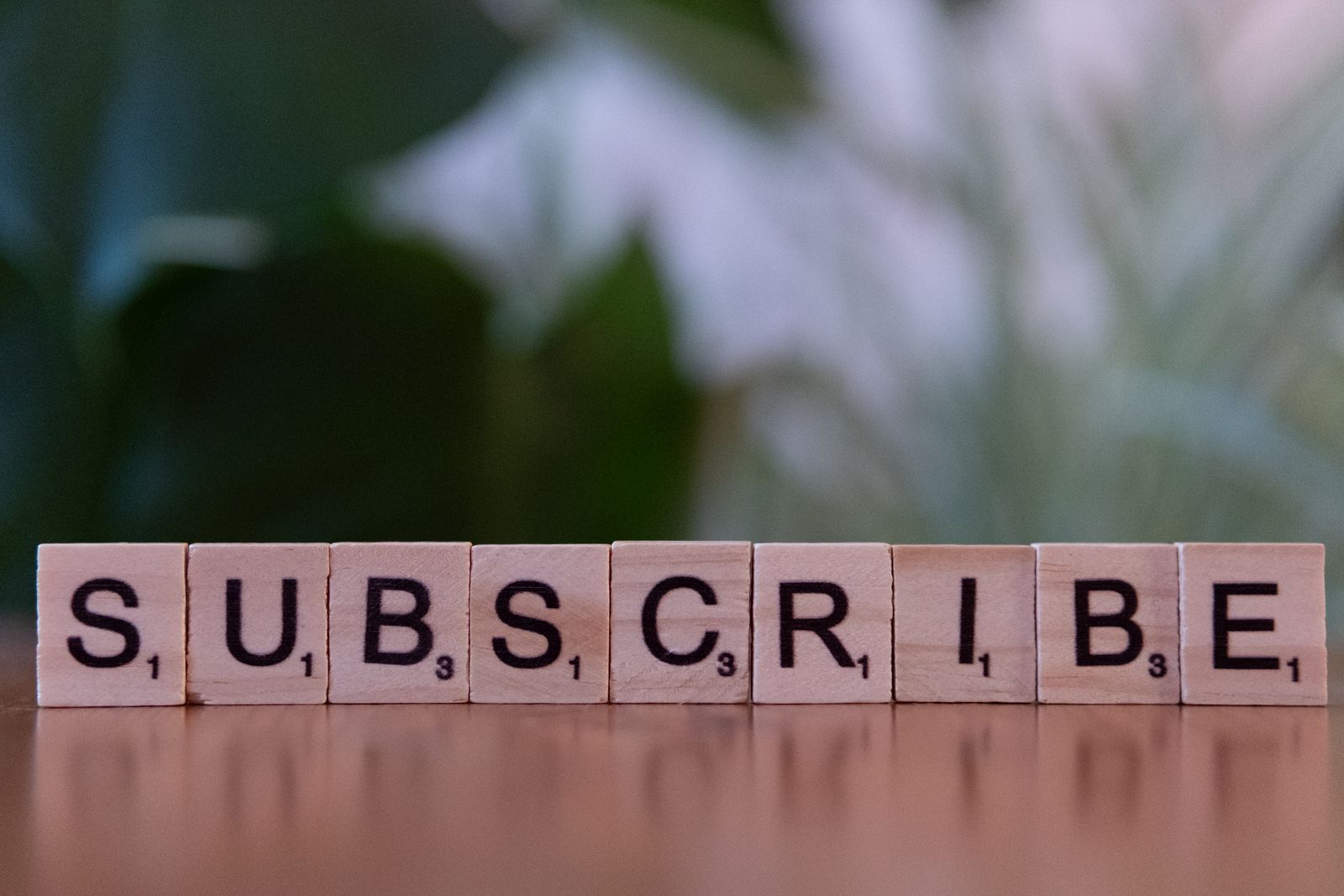 Creative subscribe text with wooden blocks