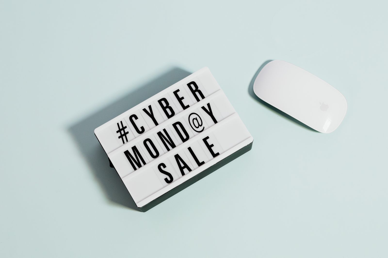 Cyber monday sale sign beside a computer mouse