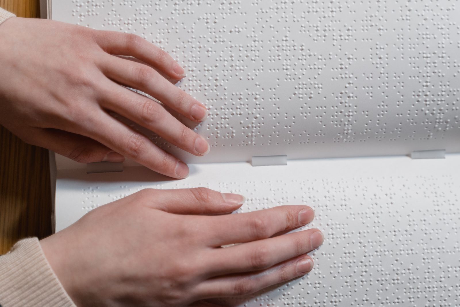 Close up shot of a person touching a braille