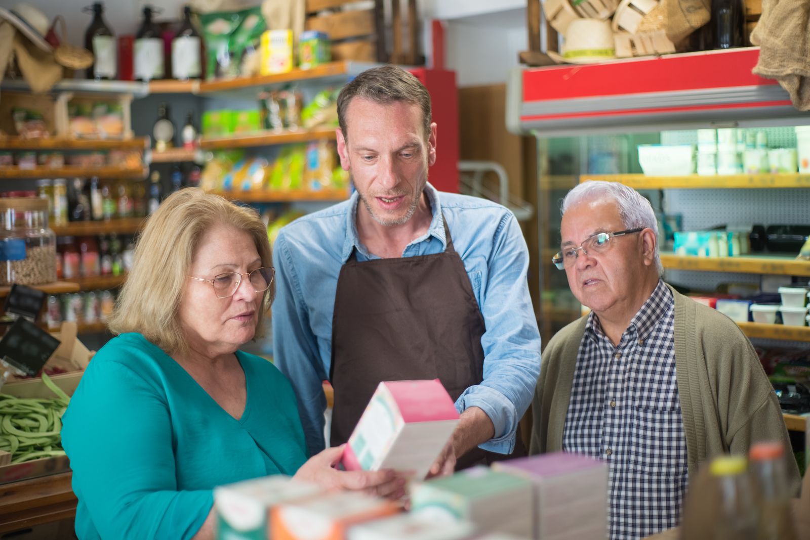 A store clerk assisting the shoppers