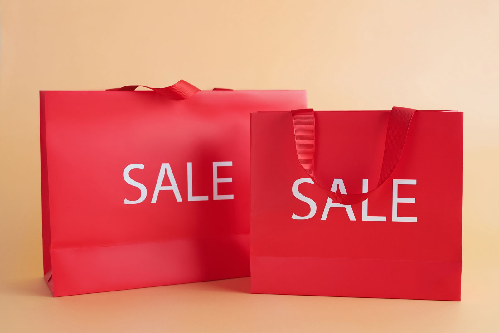 Red gift bags with sale sign